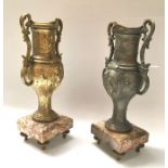 A pair of cast art metal pedestal vases, baluster twin handled form, on square chamfered marble base
