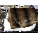 Two faux fur throws or blankets