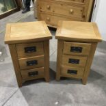 A pair of oak bedside chest of three drawers, 36cm wide (2)