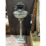 A silver plated Corinthian column oil lamp base, lens and facet cut well and Hinks No.2 wick winder