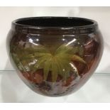 An American Weller art pottery jardiniere, painted with ferns, 17cm high