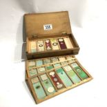 A wooden box of laboratory glass specimen slides,