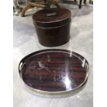 A silver plated and mahogany lacquered laminated oval tray, together with a tole ware hat box (2)