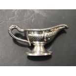 An Elizabeth II silver sauce boat, William Suckling, Birmingham, footed form, with gadrooned body