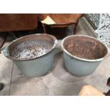 A matched pair of antique cast metal circular pots, drilled for drainage , 55 cm diameter, 42cm high