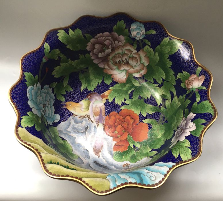 A large Chinese cloisonne bowl, circular form decorated with songbirds amongst flowering peony