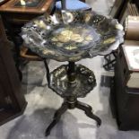 A Victorian japanned lacquer two tier tripod occasional table, fret pierced, tilt top, painted