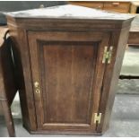 A mahogany crossbanded corner cupboard, with ebony stringing, with ogee serpentine shelves, 75cm