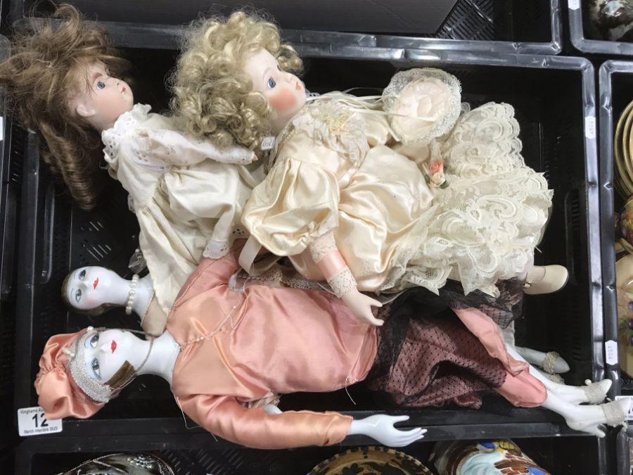 Four early 20th century and later porcelain dolls,