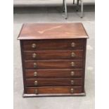 A late Victorian mahogany table top collectors' cabinet, circa 1880, chamfered top, six long