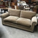 A Parker Knoll Amersham two seater sofa, in Murray Herringbone Gold upholstery, 196cm wide, together