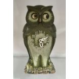 A Continental owl clock, with Arabic numerals, 24cm high