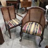 A mahogany framed Bergere armchair on cabriole supports and another example (2)
