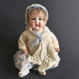 A German baby bisque head doll, sleeping blue eyes, painted open mouth, painted eyebrows and