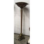 A Maitland Smith faux agate torchere floor lamp, the bowl shade within Greek key cast metal frame on