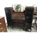 An Edwardian mahogany bureau/bookcase, central fall front above two cupboard doors, flanked by