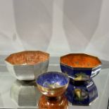 Three Wedgwood lustre bowls, two octagonal including fish, dragon and fruit examples, 23cm