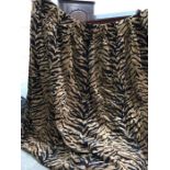 A pair of professionally made tiger print cotton lined curtains, 75cm x 220cm drop