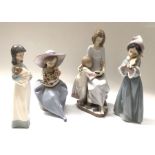 A collection of Lladro figures including Bedtime Story, Fragrant Bouquet, The Spirit of Christmas,