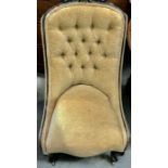 A Victorian mahogany upholstered button back chair. 96cm tall, 76cm long by 52cm wide.
