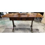 A reproduction Regency style mahogany and crossbanded sofa table, fitted two drawers, on trestle