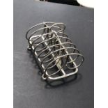 A George III silver six division toast rack, R.J.B., London 1797, wire loaf topped bars on a