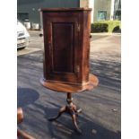 A George III oak tilt top tripod table, turned baluster support, together with an oak corner