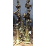 A set of four gilt brass column table lamps. 25cm high , together with a pair of resin moulded table