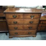 AN early Victorian mahogany chest of drawers, fitted two short over three long drawers on bracket