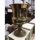 A large brass vase, goblet form on knopped flared base, 60cm high