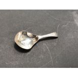 A George III silver caddy spoon, Walter Brind, London 1788, handle engraved MB, 9cm long, 0.31ozt