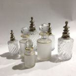 A Collection of Baccarat glass scent bottles and atomisers, including graduated set of frosted and