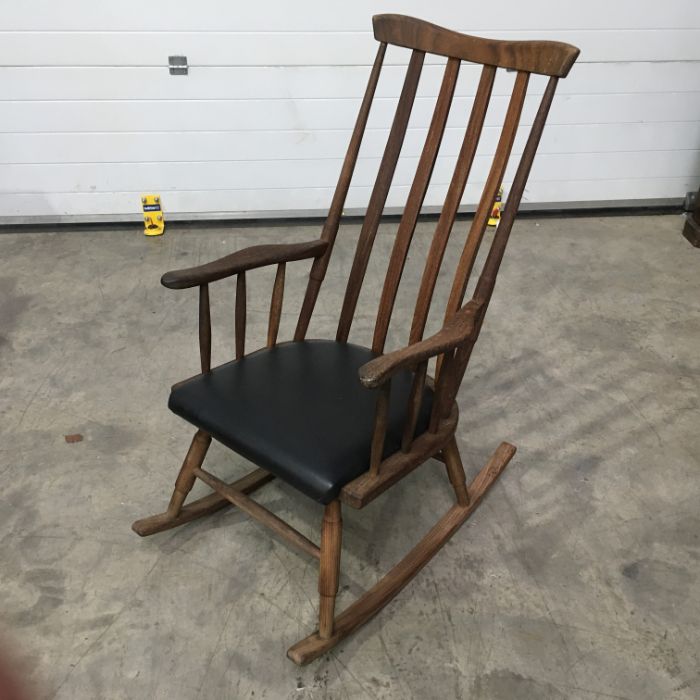 Stained beech rocking chair, comb back, shaped arms, upholstered pad seat, on turned supports and