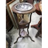 A Georgian mahogany washstand, circular bowl aperture above drawer, shaped supports uniting under