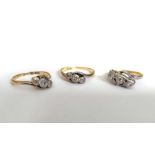 Three diamond three-stone rings, mounted in yellow metal, 6.8g (3)