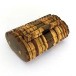A 19th Century sectional horn pocket snuff box, hinged cover, 6cm wide