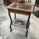 A kingwood, ebonised and marquetry inlaid work table, lift up octagonal lid, fitted and mirrored