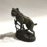 C Valton, a patinated art metal figure of a dog climbing a fence, 20cm high,