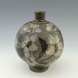 Robert Wallace Martin for Martin Brothers, a relief moulded stoneware floral vase, 1886, spherical