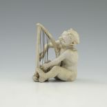 Robert Wallace Martin for Martin Brothers, a stoneware musical imp figure, 1906, modelled playing