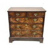A George I figured walnut and mahogany crossbanded chest of drawers, circa 1720 and later, moulded