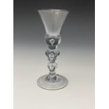 An Acorn knopped baluster wine glass