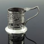 Kate Harris for Goldsmiths and Silversmiths Company, an Arts and Crafts silver tea glass holder,