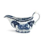 An English porcelain relief moulded blue and white sauce boat, circa 1765, probably Derby, in the