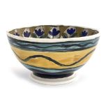 John Pearson, an Arts and Crafts lustre bowl, footed form, painted with a central peacock with
