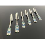 Archibald Knox for Liberty and Co., an Arts and Crafts set of six silver and enamelled Medea