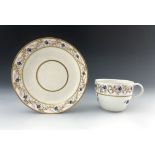 A Pinxton porcelain tea cup and saucer, pattern 14, circa 1800, painted and gilded with chantilly