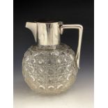 After Christopher Dresser, an Aesthetic Movement silver and cut glass claret jug, Heath and Middleto