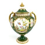 C Harris for Royal Crown Derby, a twin handled pedestal vase and cover, urn form painted with exotic