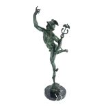 After Giambologna, a green patinated bronzed figure of Mercury, mounted on a black veined circular